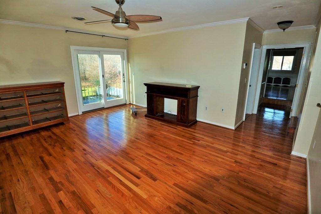 38 Pleasant Street Whitman, MA 02382 - Photo 14 of 21 wooden floor chandelier and windows in a room