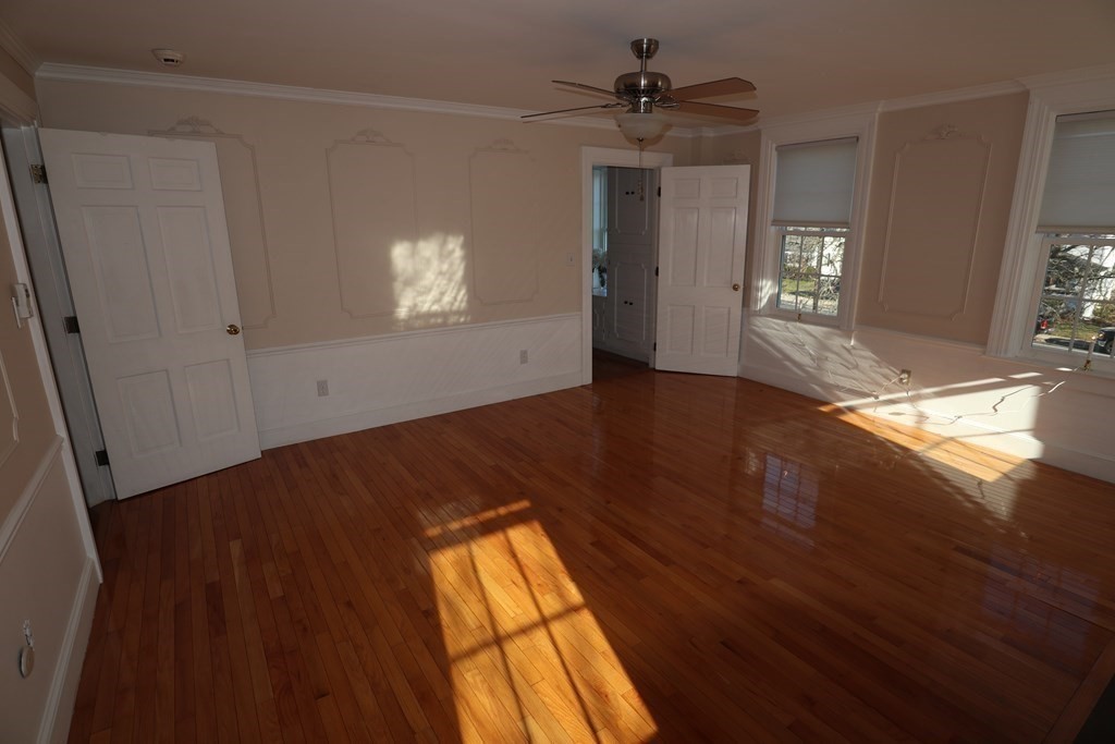 38 Pleasant Street Whitman, MA 02382 - Photo 16 of 21 wooden floor in an empty room with a window