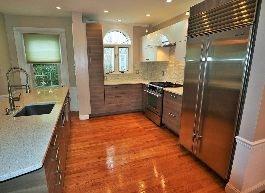 38 Pleasant Street Whitman, MA 02382 - Photo 5 of 21 a kitchen with stainless steel appliances granite countertop a sink and a refrigerator