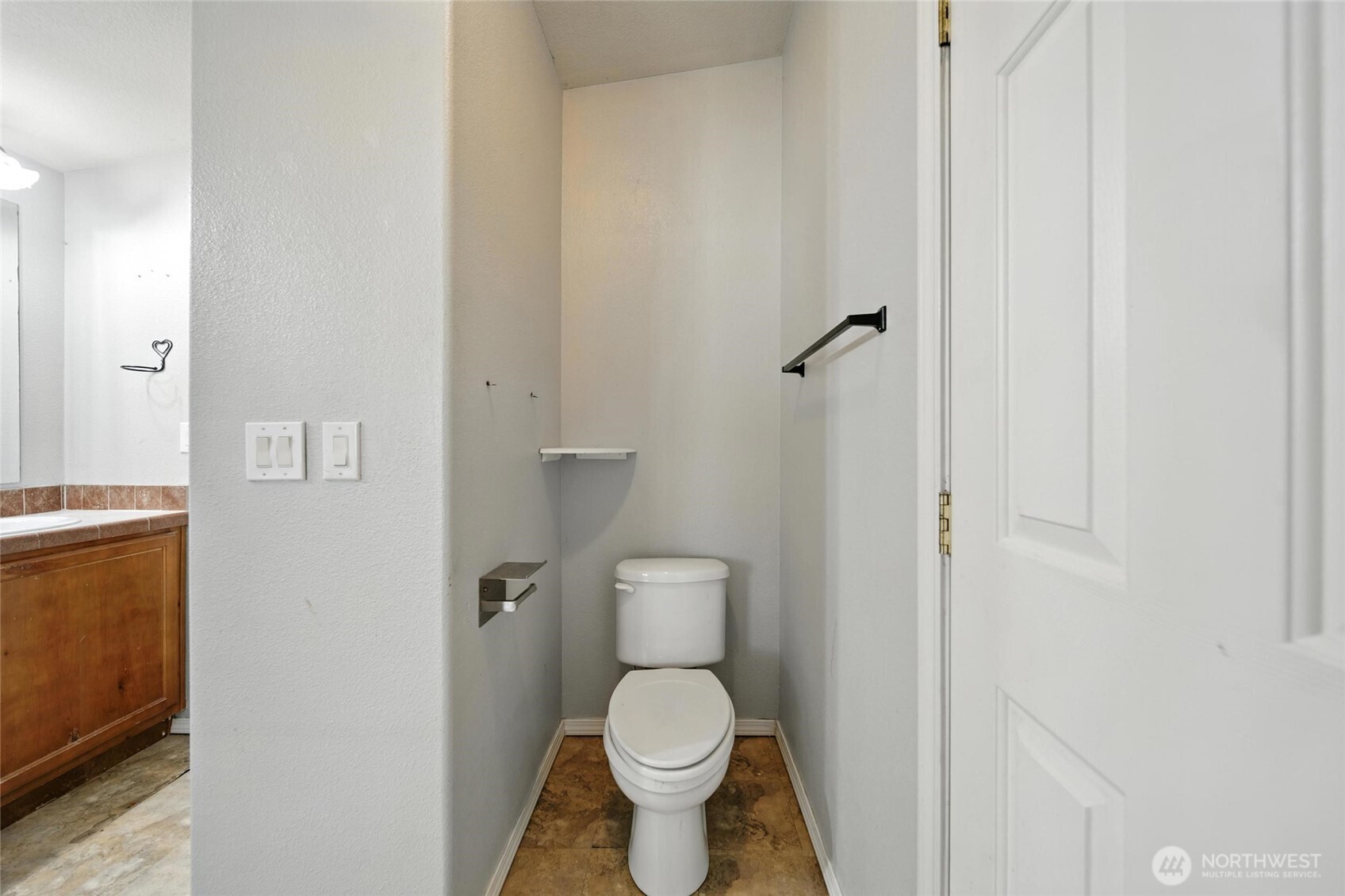538 Burnap Road Touchet, WA 99360 - Photo 17 of 40 a white toilet sitting next to a white cabinet