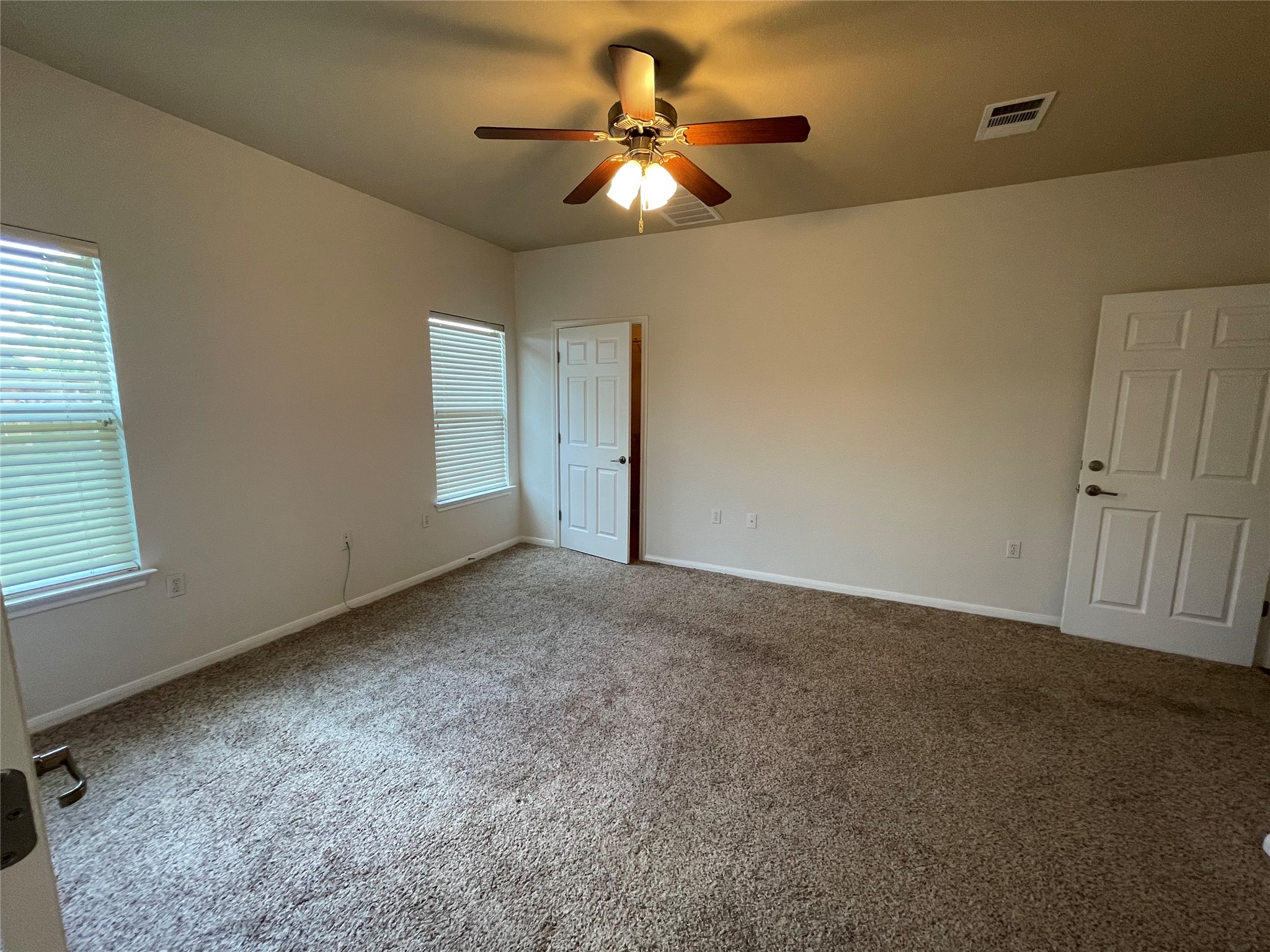 3517 Bronco Bend Loop Austin, TX 78744 - Photo 27 of 39 Unfurnished bedroom featuring ceiling fan and carpet floors