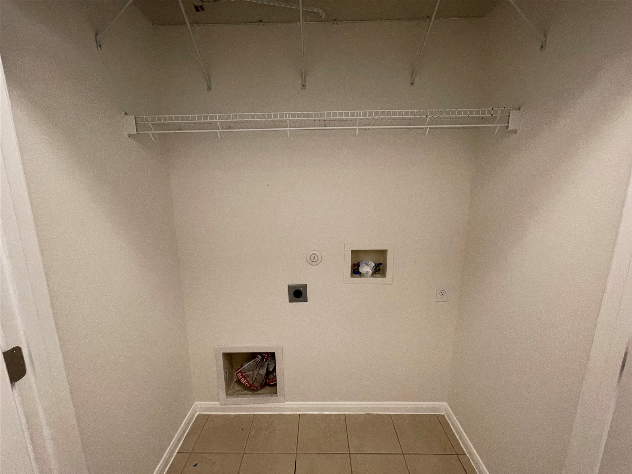 3517 Bronco Bend Loop Austin, TX 78744 - Photo 30 of 39 Laundry area with washer hookup, hookup for an electric dryer, gas dryer hookup, and light tile patterned floors