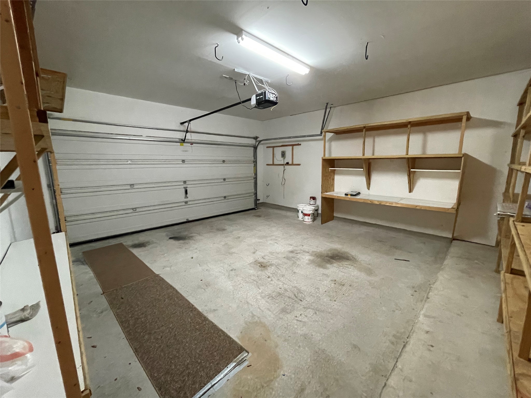 3517 Bronco Bend Loop Austin, TX 78744 - Photo 31 of 39 Garage with a garage door opener