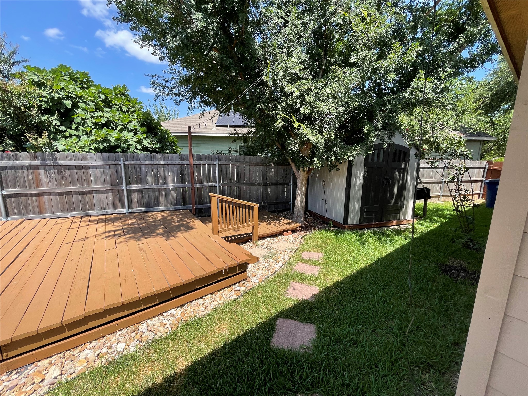 3517 Bronco Bend Loop Austin, TX 78744 - Photo 34 of 39 Fenced backyard featuring a deck and a shed