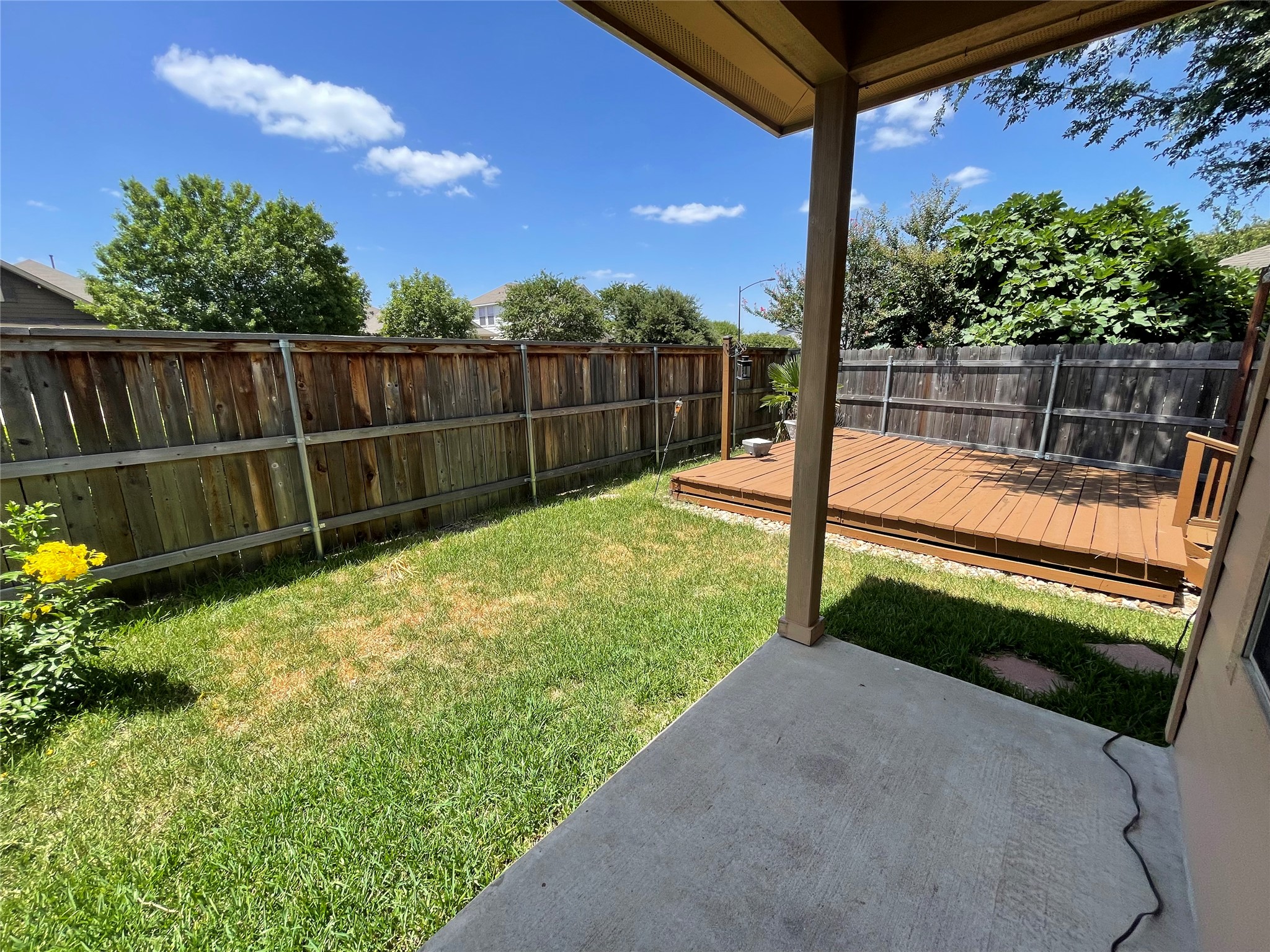 3517 Bronco Bend Loop Austin, TX 78744 - Photo 35 of 39 Fenced backyard with a wooden deck and a patio area