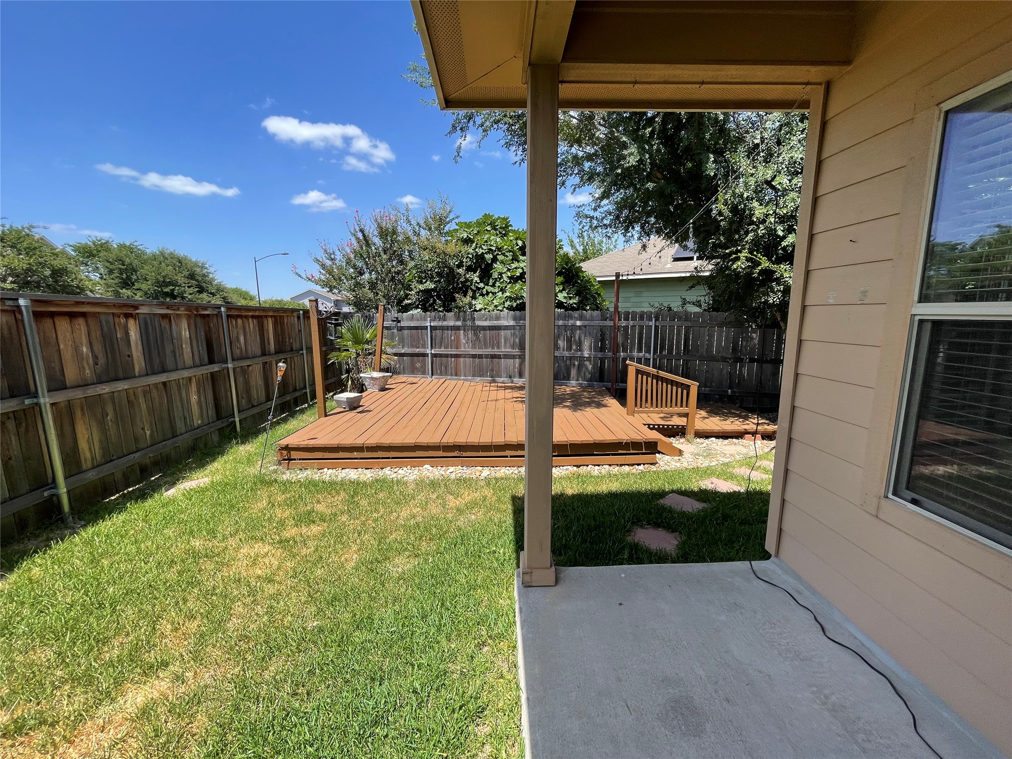 3517 Bronco Bend Loop Austin, TX 78744 - Photo 36 of 39 Fenced backyard featuring a wooden deck and a patio