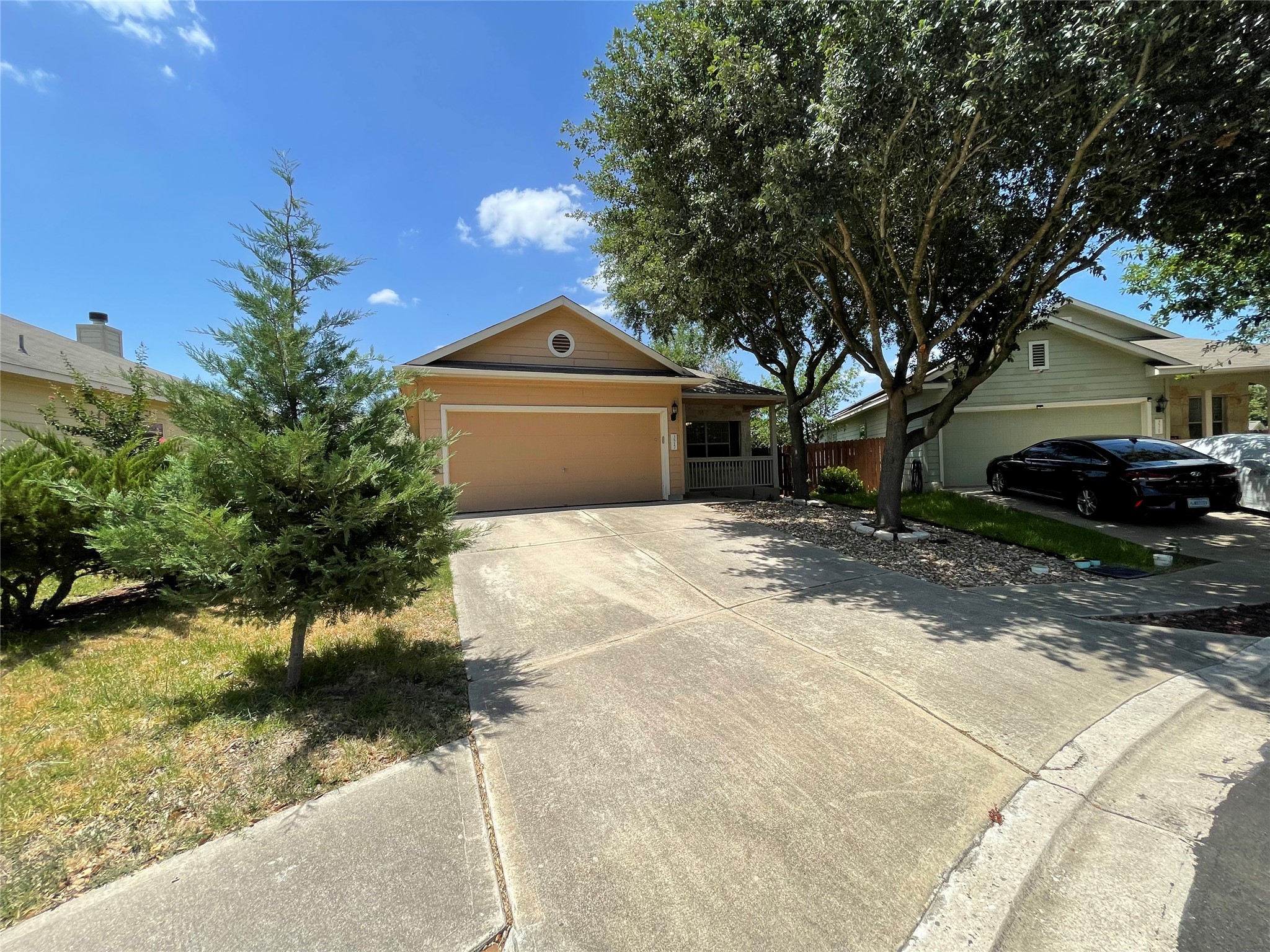 3517 Bronco Bend Loop Austin, TX 78744 - Photo 4 of 39 Single story home with an attached garage and driveway