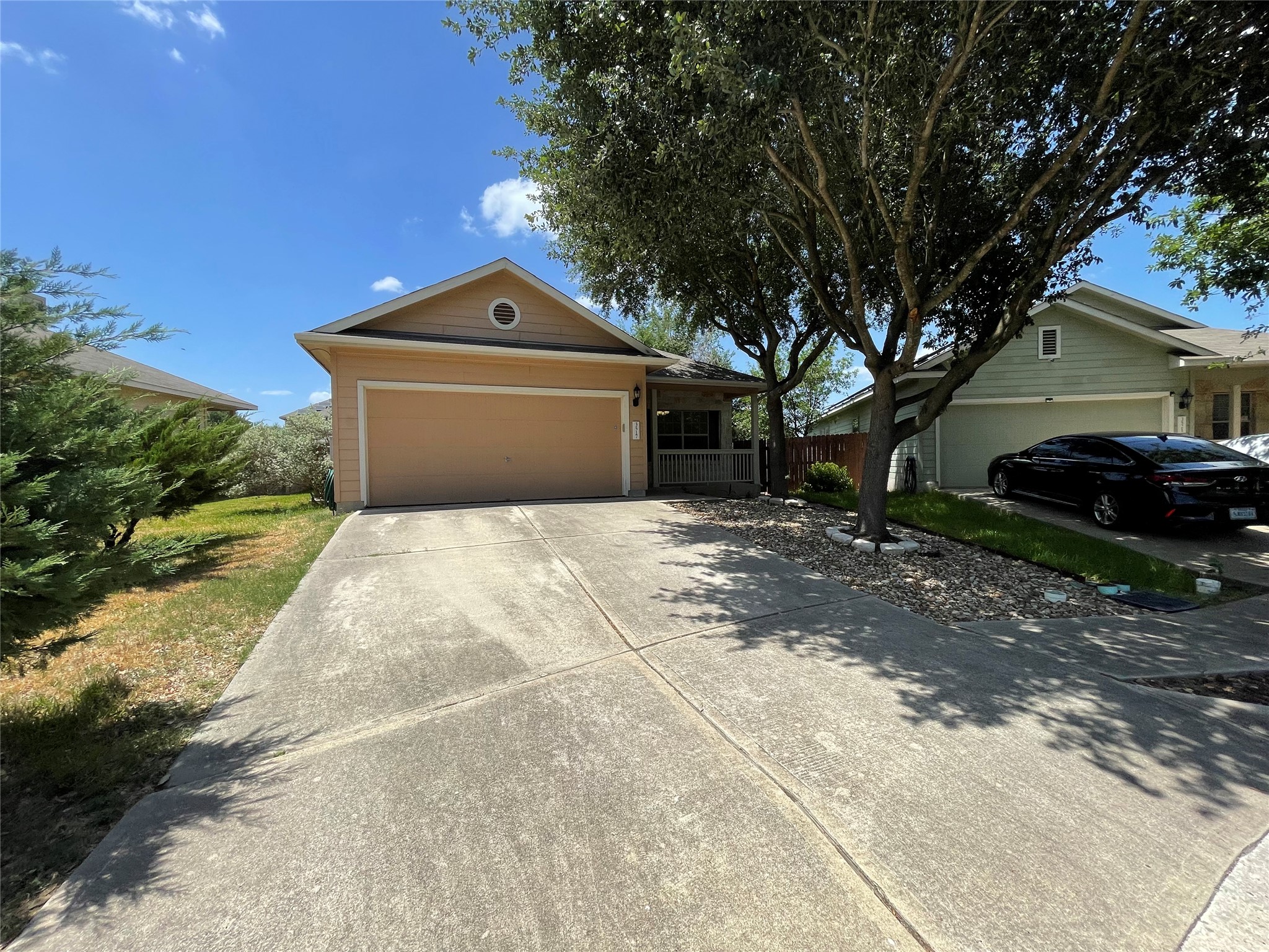 3517 Bronco Bend Loop Austin, TX 78744 - Photo 5 of 39 Ranch-style home with a garage and concrete driveway