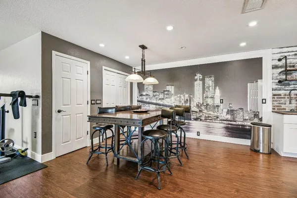 a living room with furniture or wooden floor and a large window