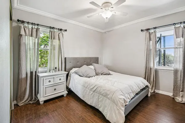 a bathroom with a shower curtain and a window