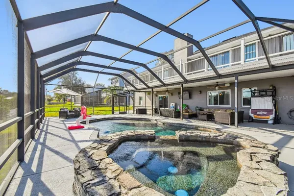 an aerial view of a houses with outdoor space