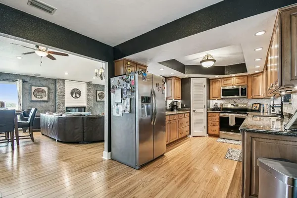 a view of a livingroom with workspace and a couch