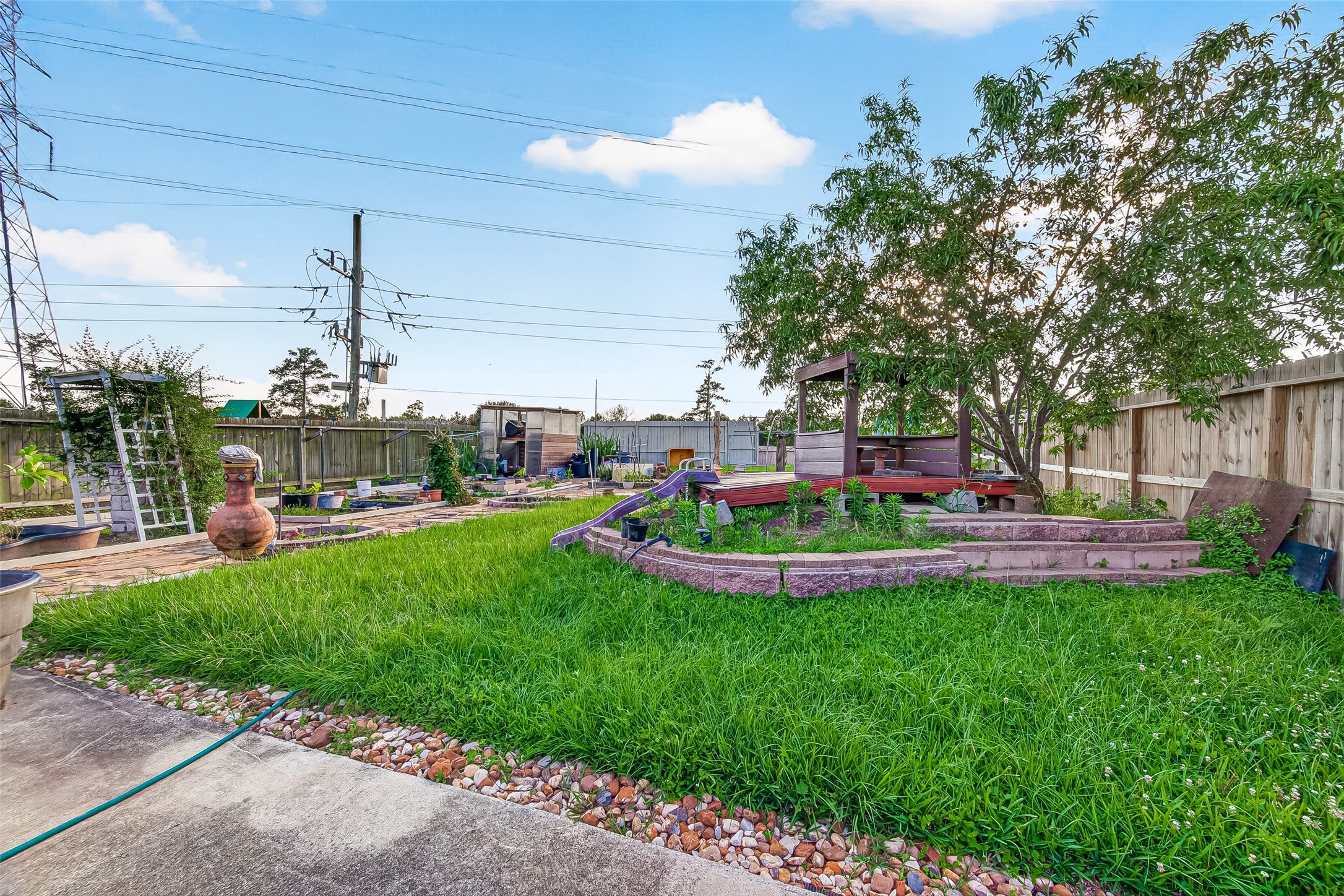 16715 Mackenzie Mesa Drive Spring, TX 77379 - Photo 46 of 50 a front view of a house with a garden