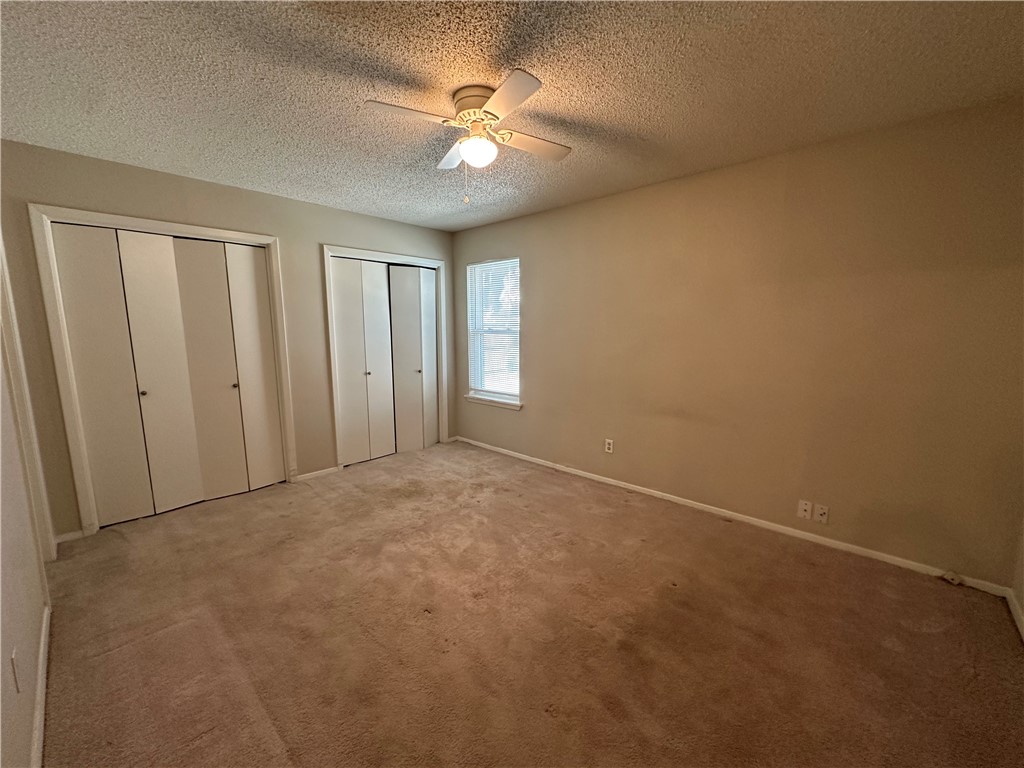 1506 Briar Street Portland, TX 78374 - Photo 16 of 40 an empty room with windows and fan