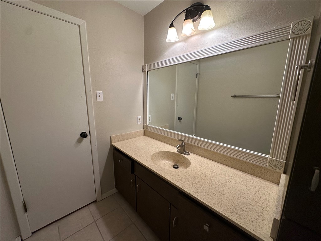 1506 Briar Street Portland, TX 78374 - Photo 19 of 40 a bathroom with a sink and mirror