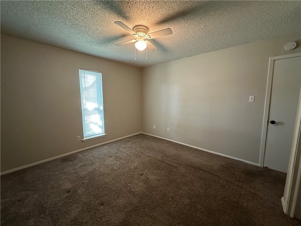 1506 Briar Street Portland, TX 78374 - Photo 26 of 40 an empty room with windows and fan