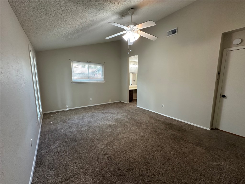 1506 Briar Street Portland, TX 78374 - Photo 31 of 40 an empty room with windows and fan