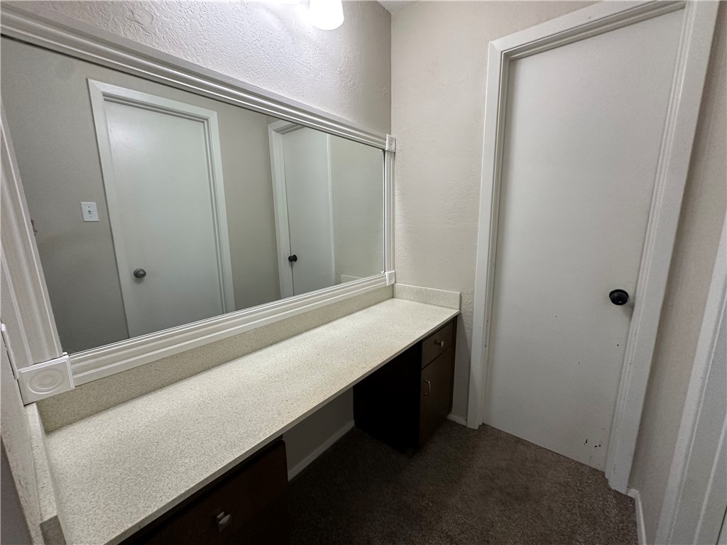 1506 Briar Street Portland, TX 78374 - Photo 32 of 40 a room with a wooden floor and vanity