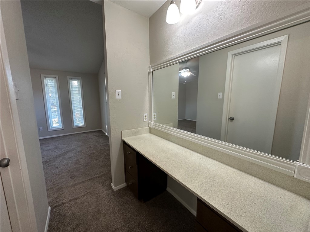 1506 Briar Street Portland, TX 78374 - Photo 33 of 40 a bathroom with a sink a shower and a mirror