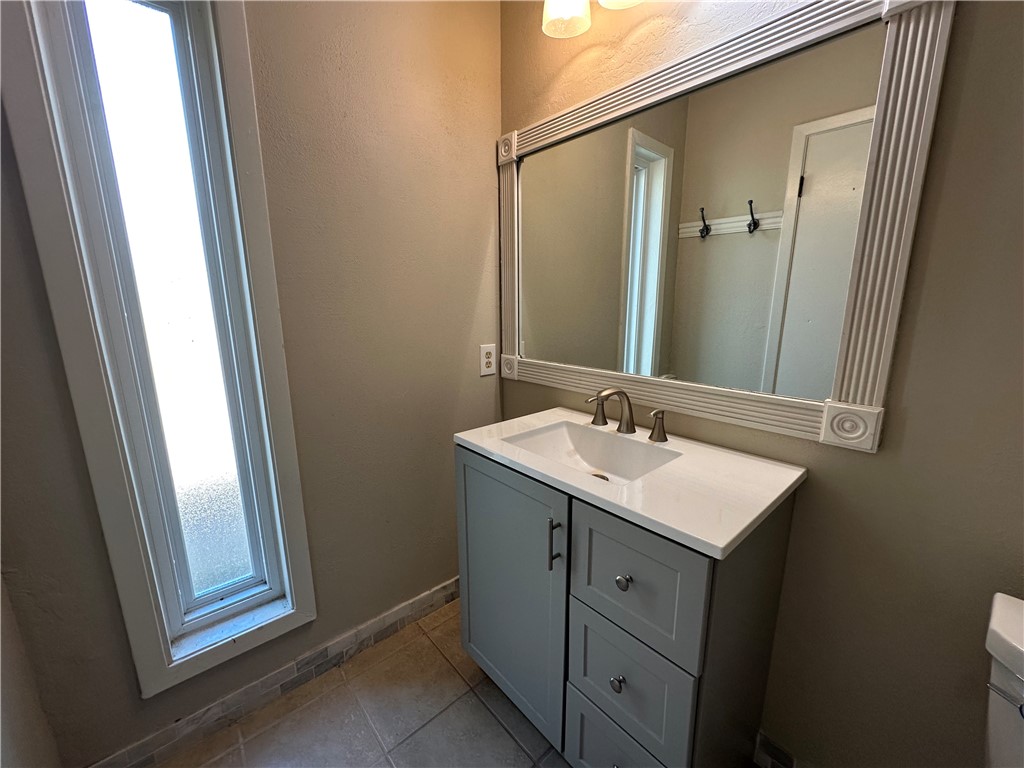 1506 Briar Street Portland, TX 78374 - Photo 34 of 40 a bathroom with a sink and a mirror