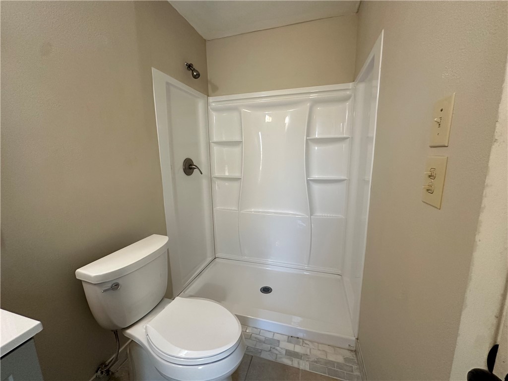 1506 Briar Street Portland, TX 78374 - Photo 35 of 40 a white toilet sitting next to a bathroom sink