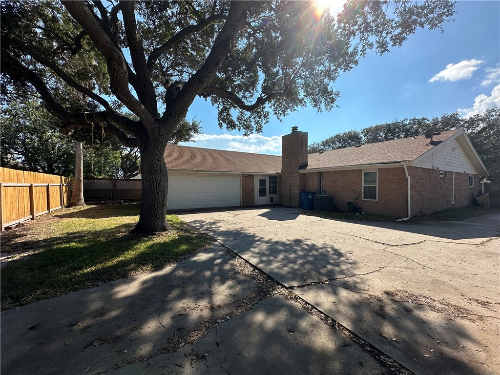 1506 Briar Street Portland, TX 78374 - Photo 40 of 40 a front view of a house with a yard and garage