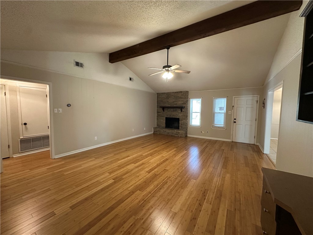 1506 Briar Street Portland, TX 78374 - Photo 6 of 40 a view of an empty room with wooden floor and a window