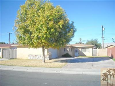 82130 Adobe Road Indio, CA 92201 - Photo 1 of 11 a view of a house with a yard and tree s