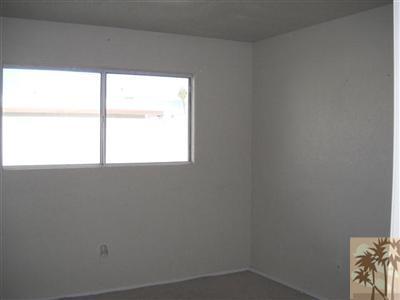 82130 Adobe Road Indio, CA 92201 - Photo 8 of 11 a view of an empty room with a window