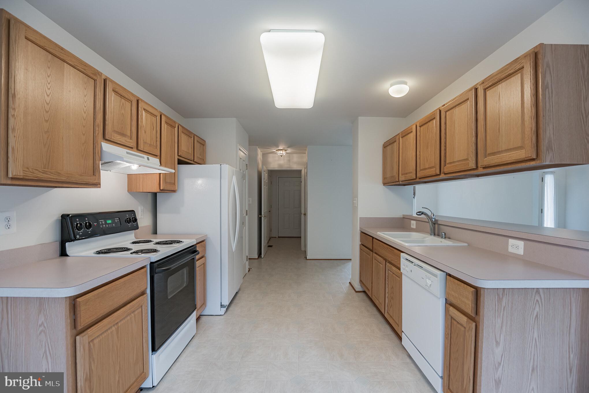 1831 Lottie Fowler Road Prince Frederick, MD 20678 - Photo 7 of 30 Kitchen; Thru door to separate Laundry Room
