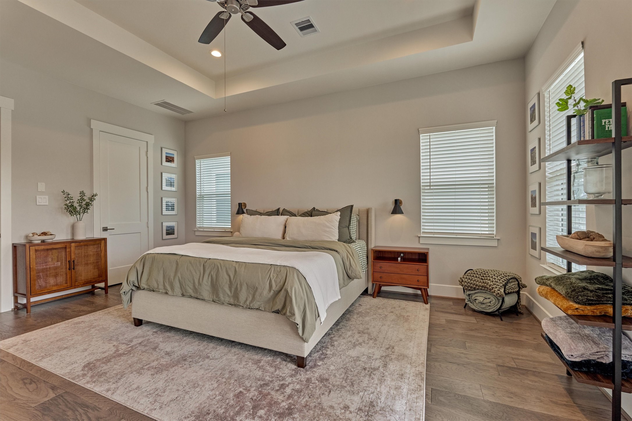 62 Dobbs View Lane Spring, TX 77389 - Photo 21 of 42 a bedroom with a bed and dresser with wooden floor