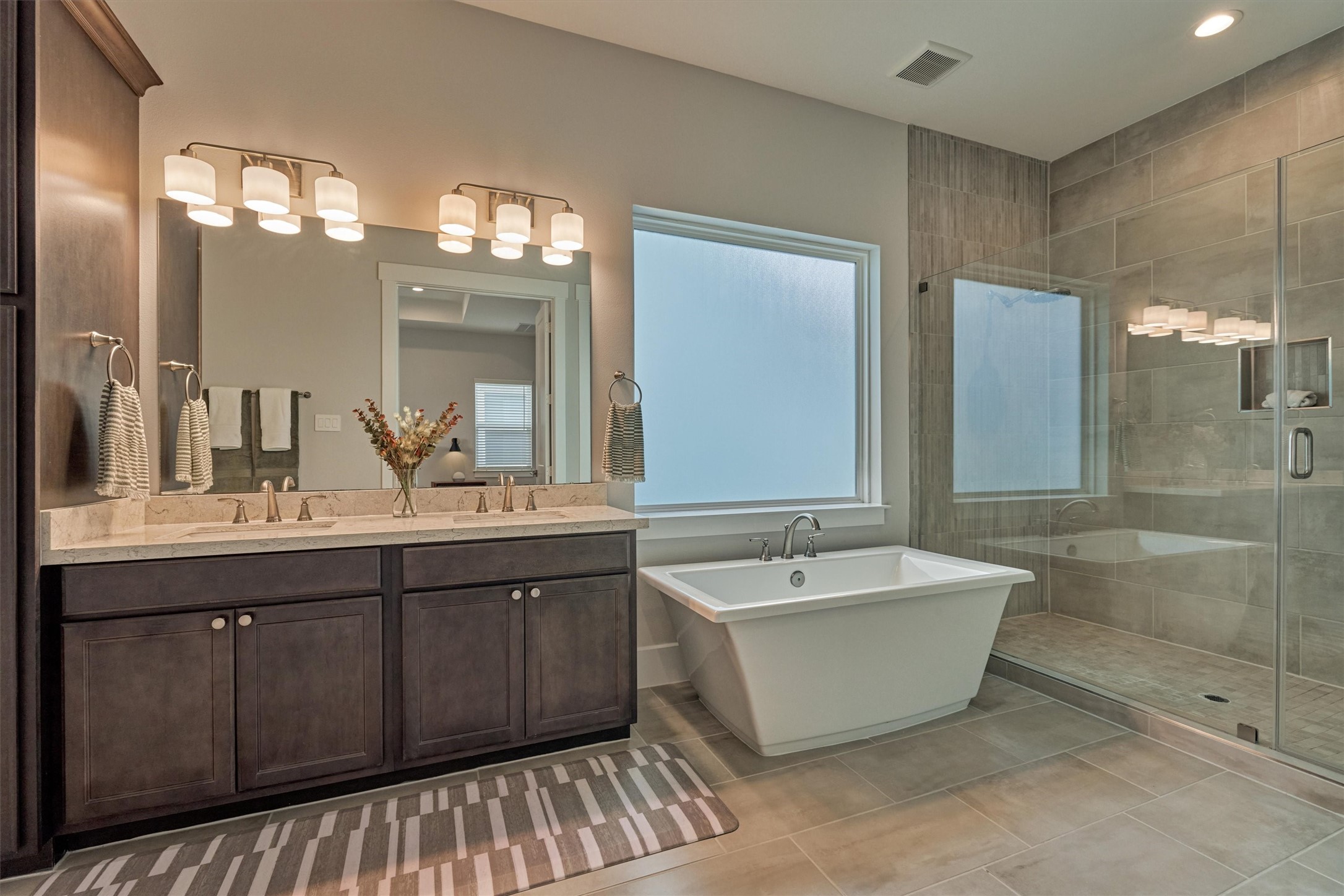 62 Dobbs View Lane Spring, TX 77389 - Photo 23 of 42 a spacious bathroom with a double vanity sink mirror and bathtub