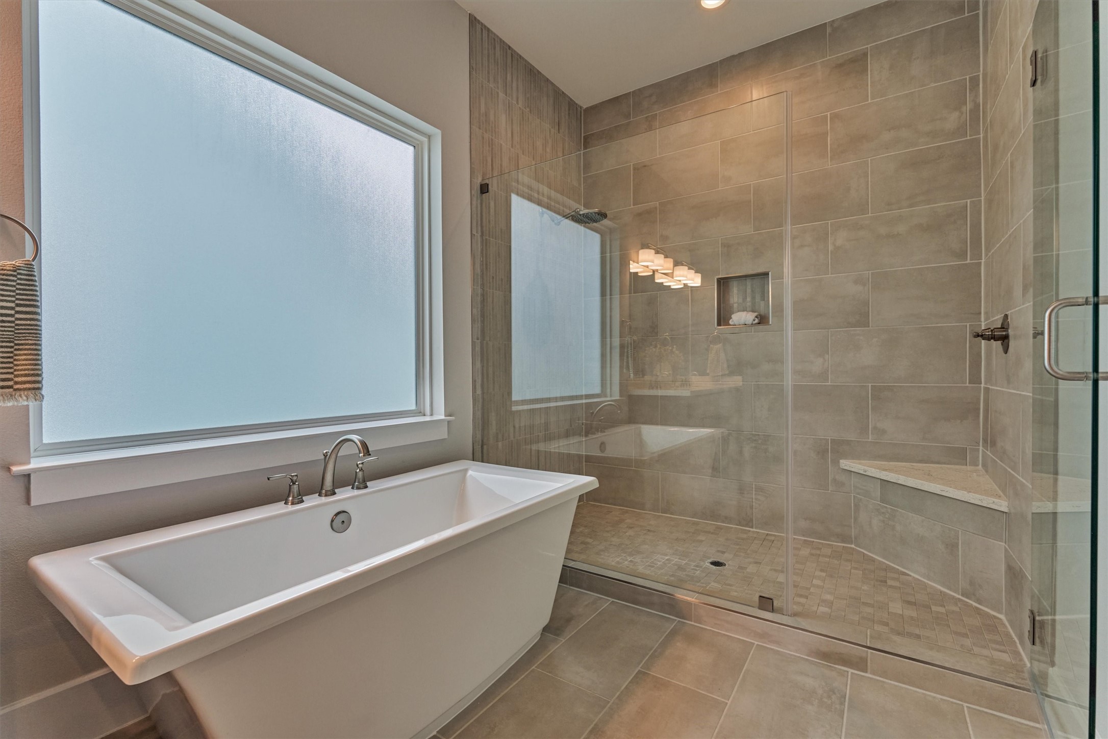 62 Dobbs View Lane Spring, TX 77389 - Photo 25 of 42 a bathroom with a bathtub and a shower