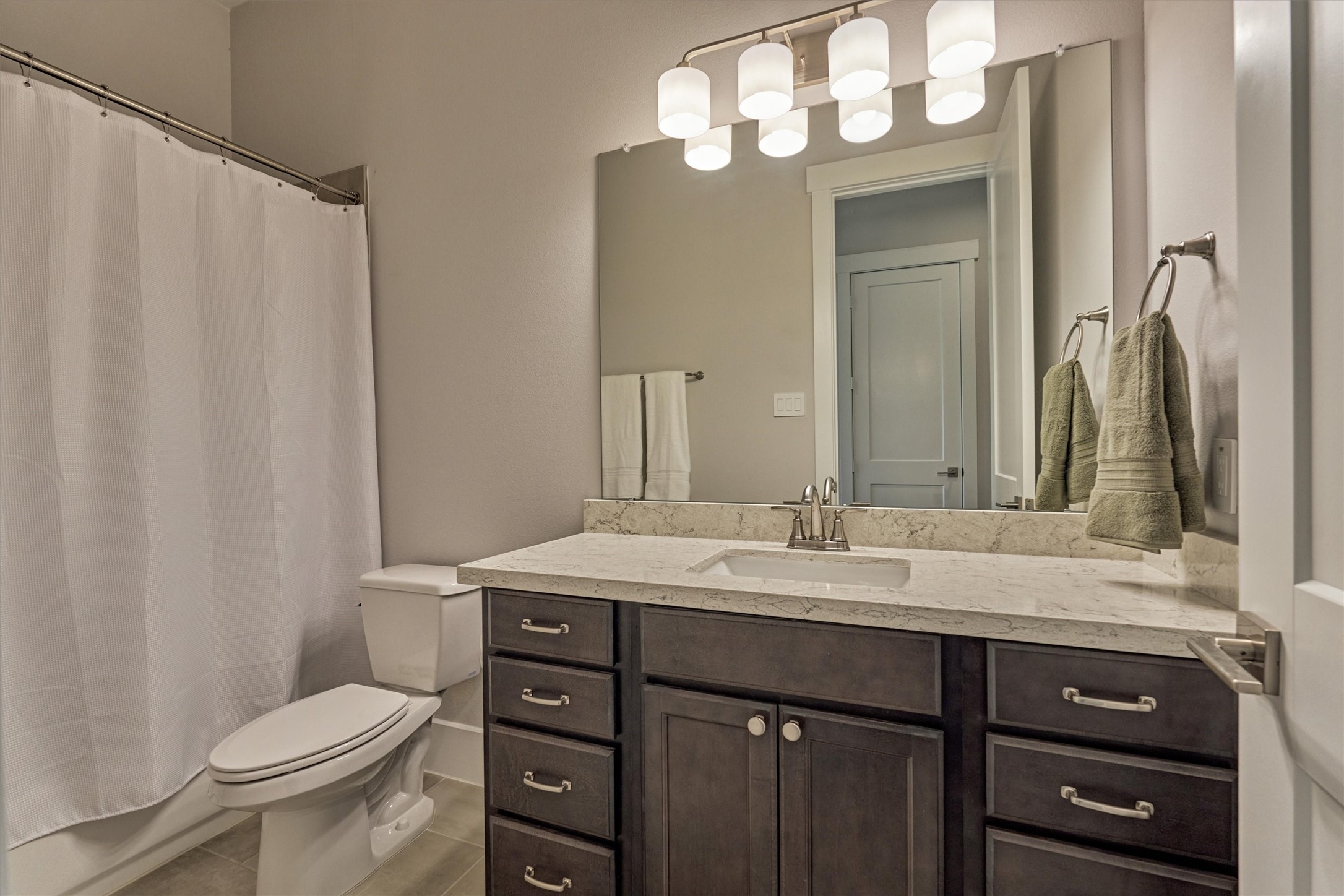 62 Dobbs View Lane Spring, TX 77389 - Photo 29 of 42 a bathroom with a sink a toilet and a mirror