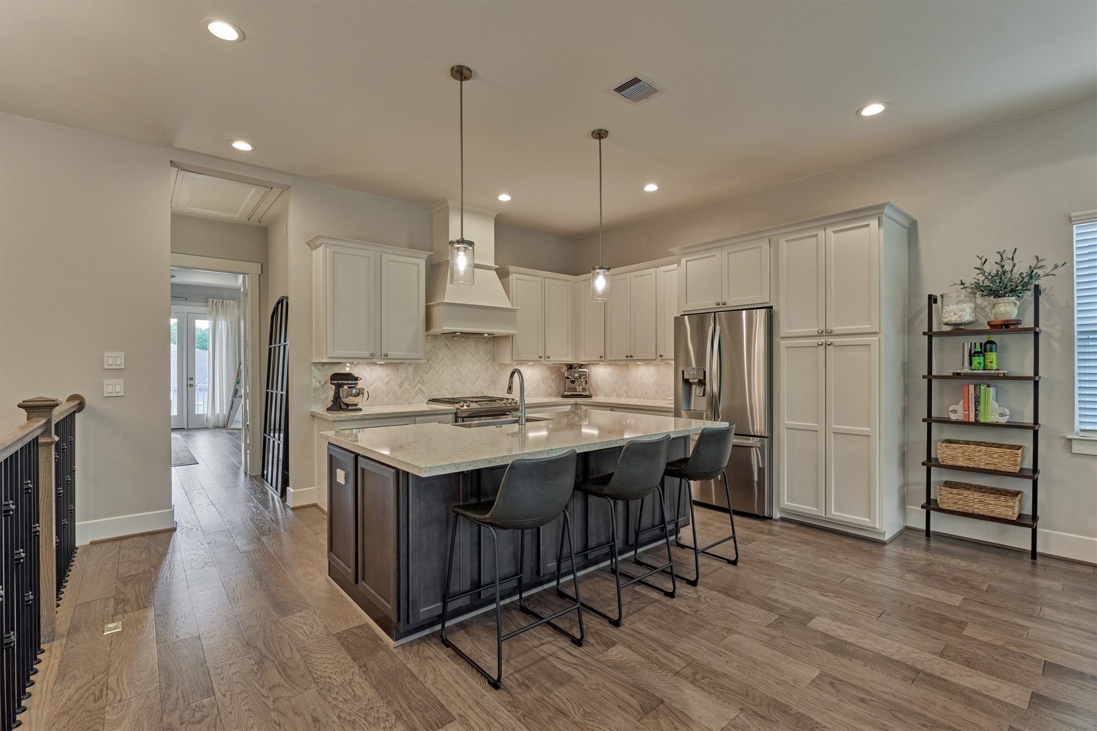 62 Dobbs View Lane Spring, TX 77389 - Photo 8 of 42 a kitchen with stainless steel appliances a stove a sink a refrigerator and a island with wooden floor