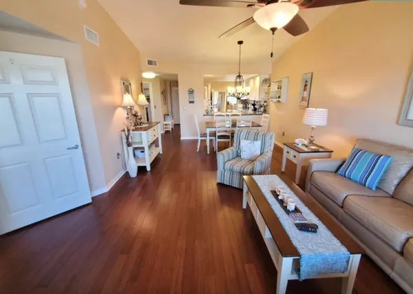 a living room with furniture fireplace and flat screen tv