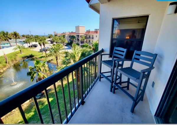 a view of a balcony with chairs