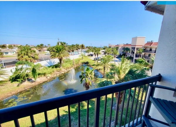 a view of a balcony with chairs