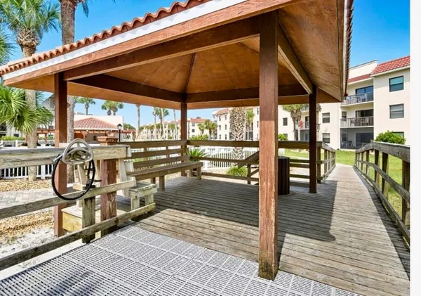 a view of a swimming pool with outdoor seating