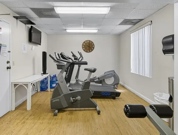 a room with gym equipment and a window