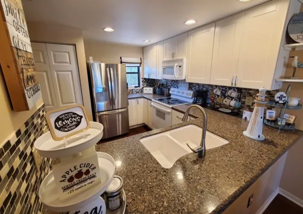 a kitchen with sink and window