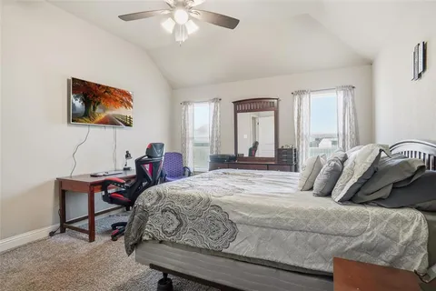 a bedroom with a bed and a table