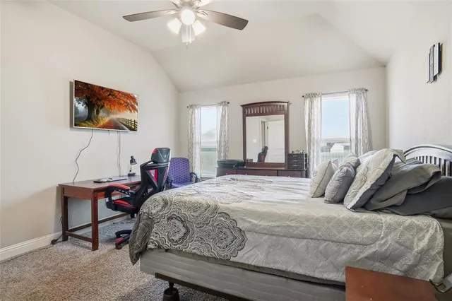 a bedroom with a bed and a table