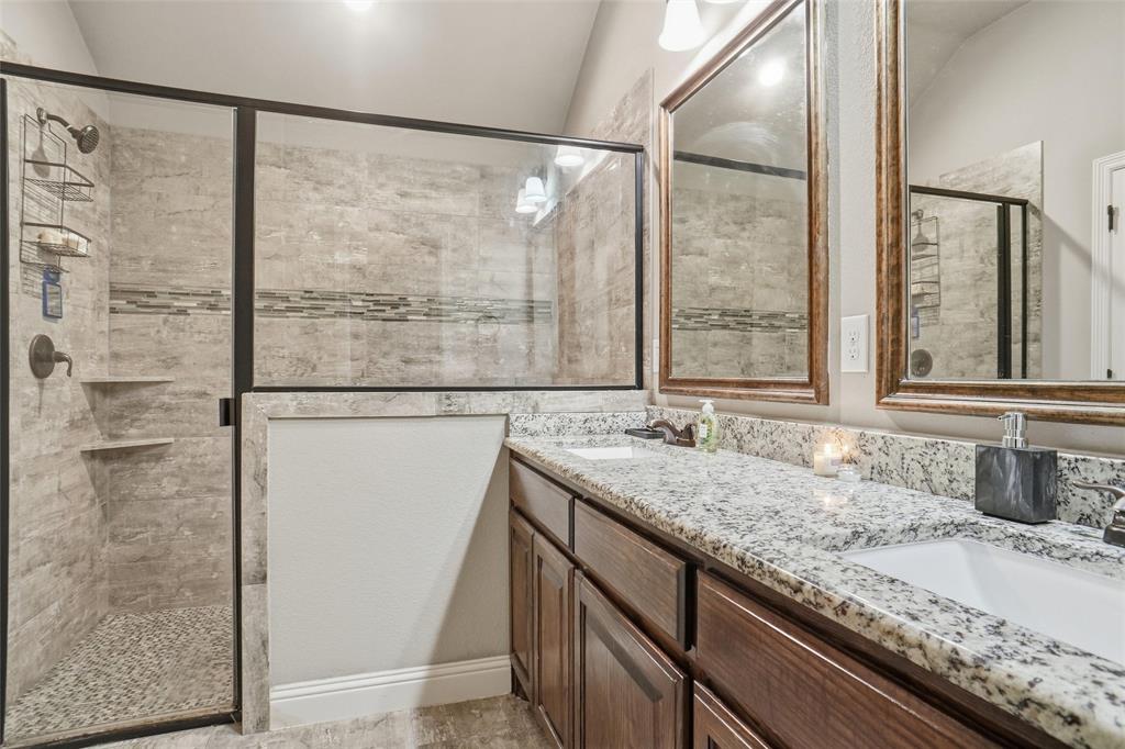 206 McKittrick Lane Godley, TX 76044 - Photo 18 of 28 Bathroom with a shower stall and double vanity