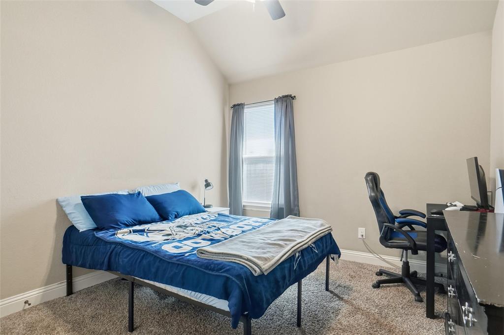 206 McKittrick Lane Godley, TX 76044 - Photo 22 of 28 Bedroom featuring lofted ceiling, carpet floors, a ceiling fan, and a desk