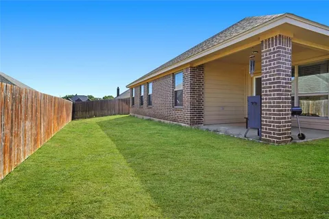a view of a backyard with a garden