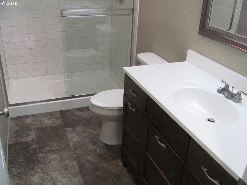 1940 Northeast 3rd Loop Camas, WA 98607 - Photo 14 of 22 a bathroom with a sink a toilet and shower