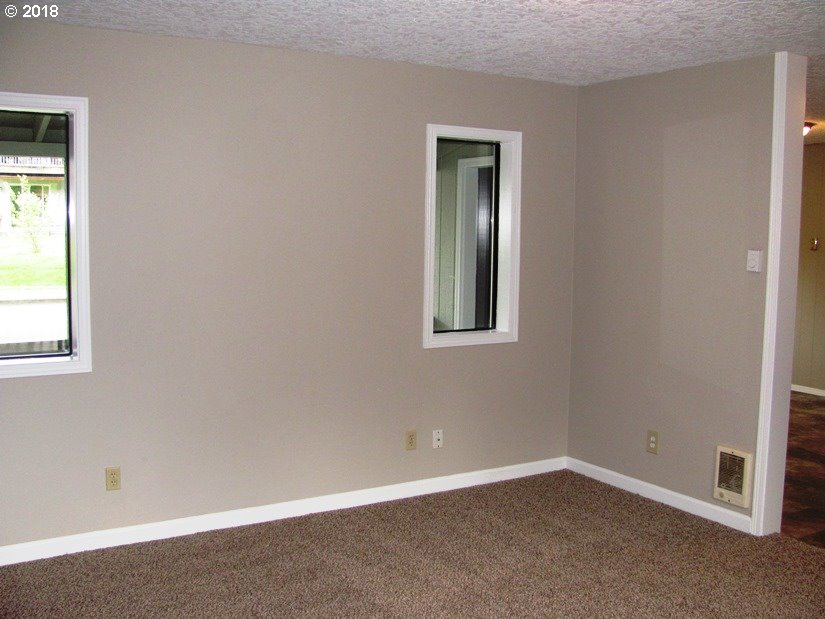 1940 Northeast 3rd Loop Camas, WA 98607 - Photo 3 of 22 an empty room with a window