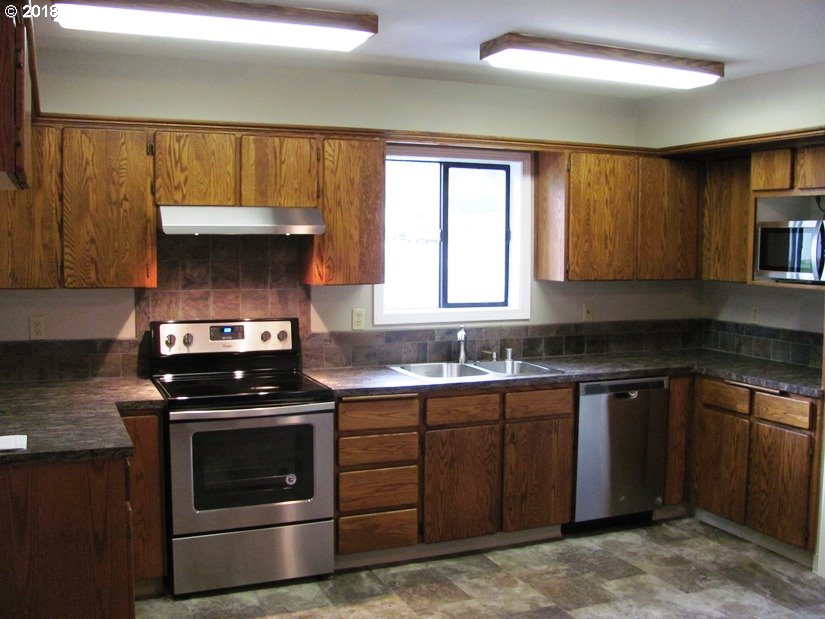 1940 Northeast 3rd Loop Camas, WA 98607 - Photo 5 of 22 a kitchen with a stove and a sink