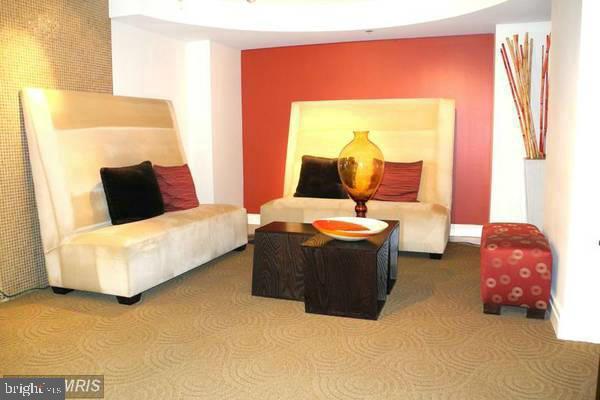 915 E Street Northwest, Unit 702 Washington, DC 20004 - Photo 2 of 10 a bed room with a bed and a couch